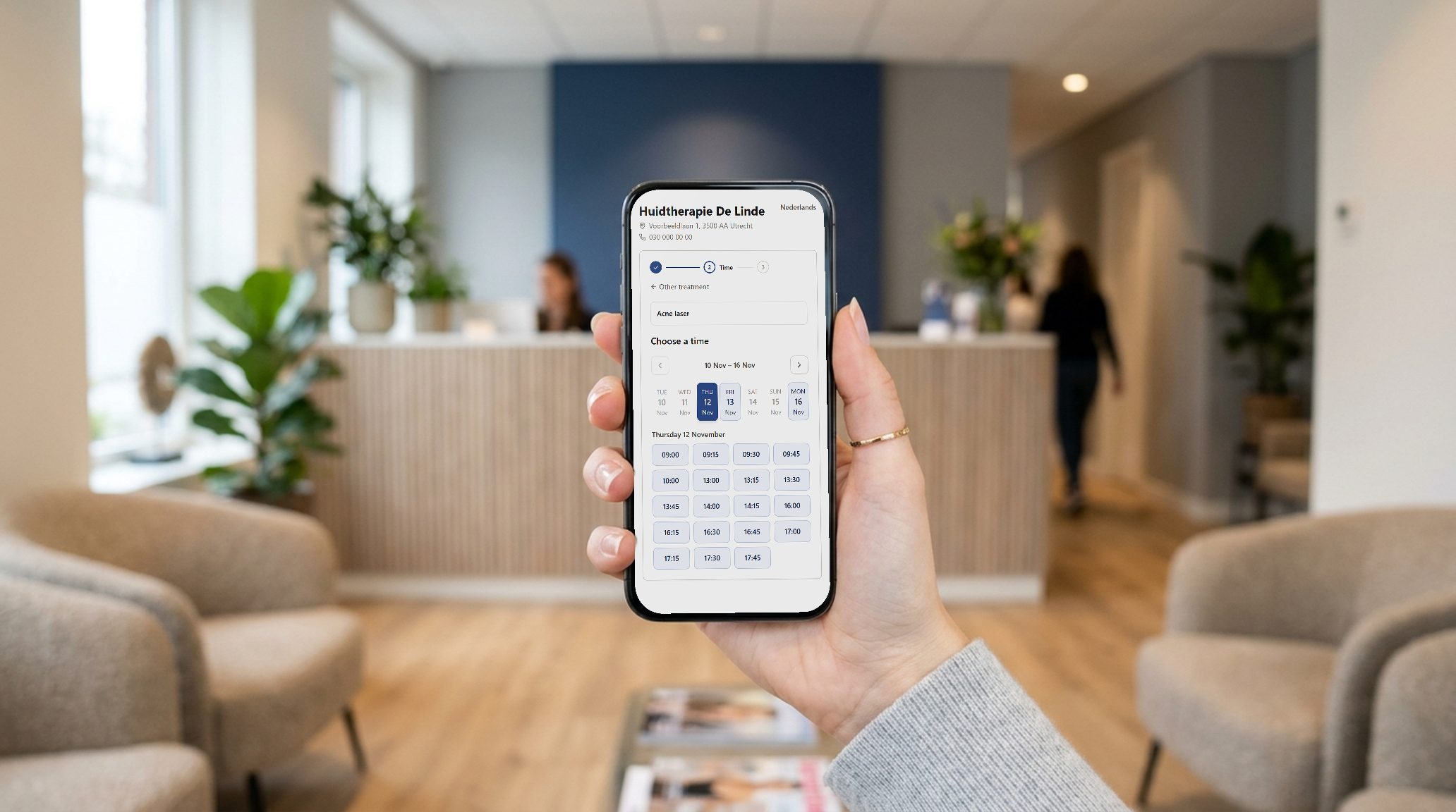 A client picks a time on the booking page, on her phone in the waiting room