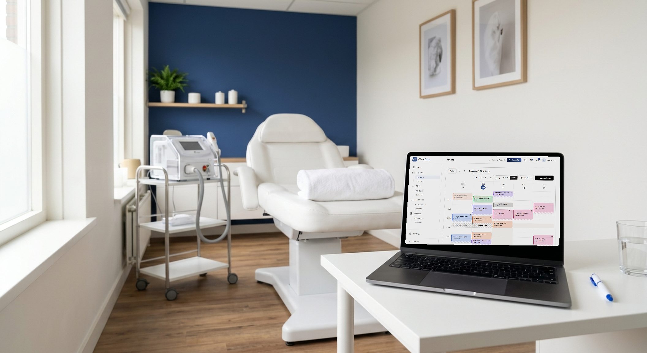 A treatment room with the ClinicBase calendar on the laptop